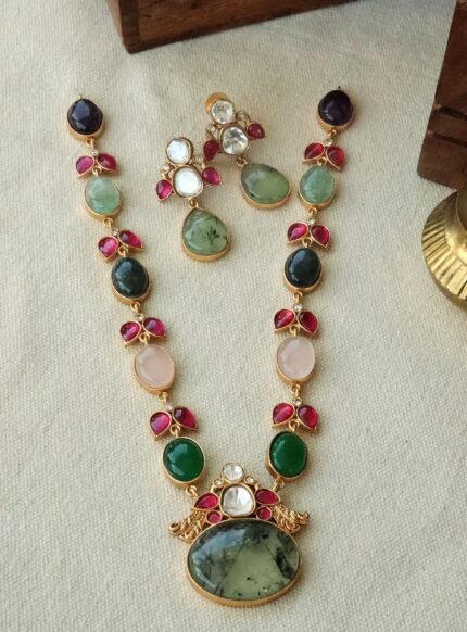 kalavritti necklace with precious stone embellishments.