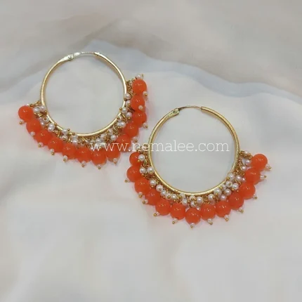 Round beads and pearl hoops in orange