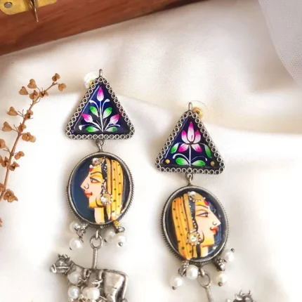 Raja Rani handpainted earrings with pichwai hangings.